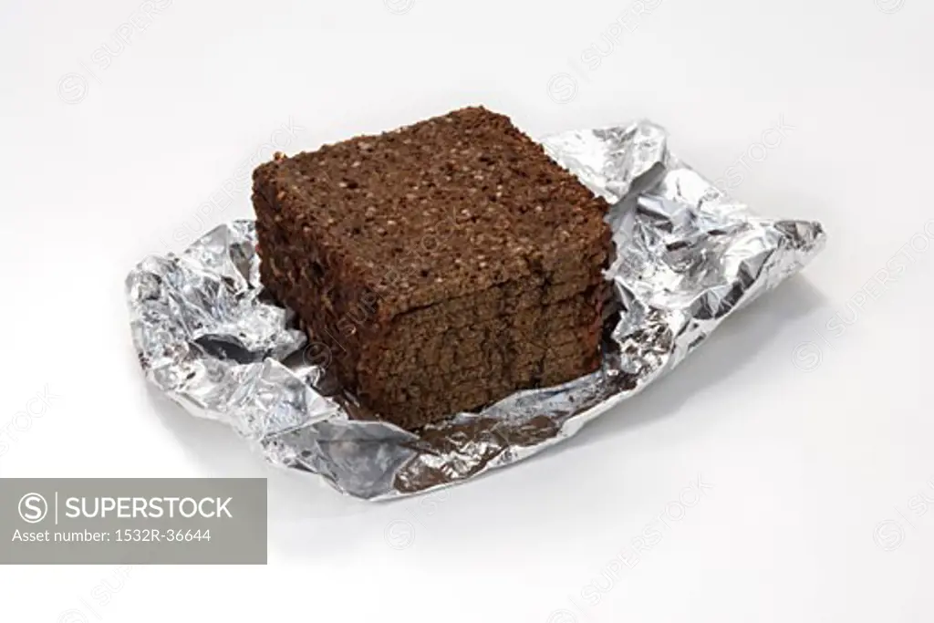 Slices of black bread in aluminium foil