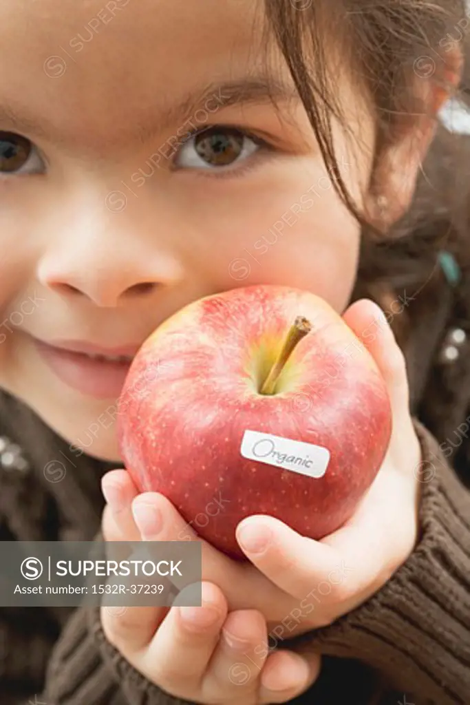 Girl with an organic apple