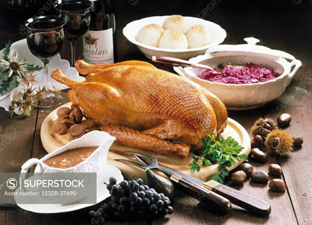 Roast goose with chestnut stuffing, red cabbage & dumplings