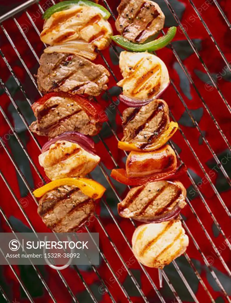 Loin of pork on skewers on a barbecue