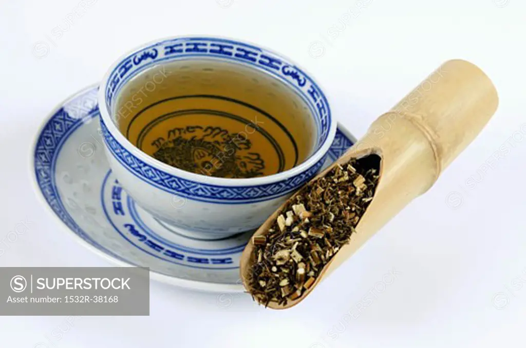 Mugwort herb with a cup of tea