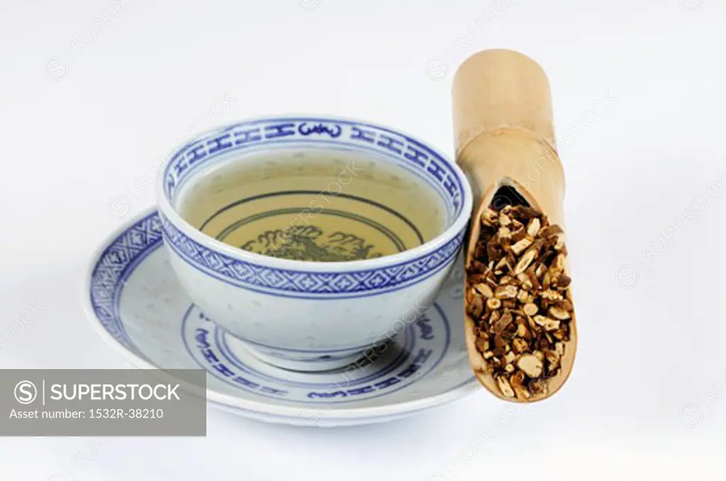 Bowl of tea with hare's ear root in a bamboo cane