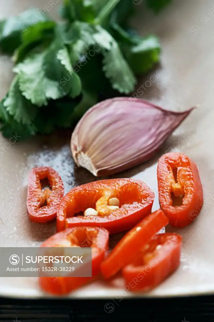 Coriander, a garlic clove and sliced chilli
