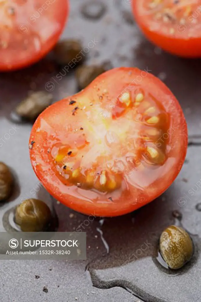 Halved cherry tomatoes with capers and vinaigrette