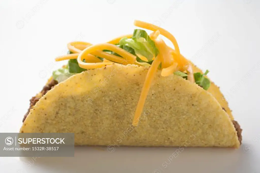 Taco filled with mince, lettuce and cheese