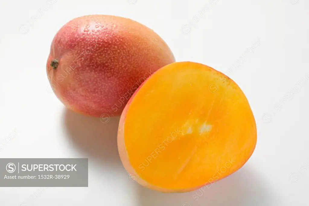 Whole mango and half a mango