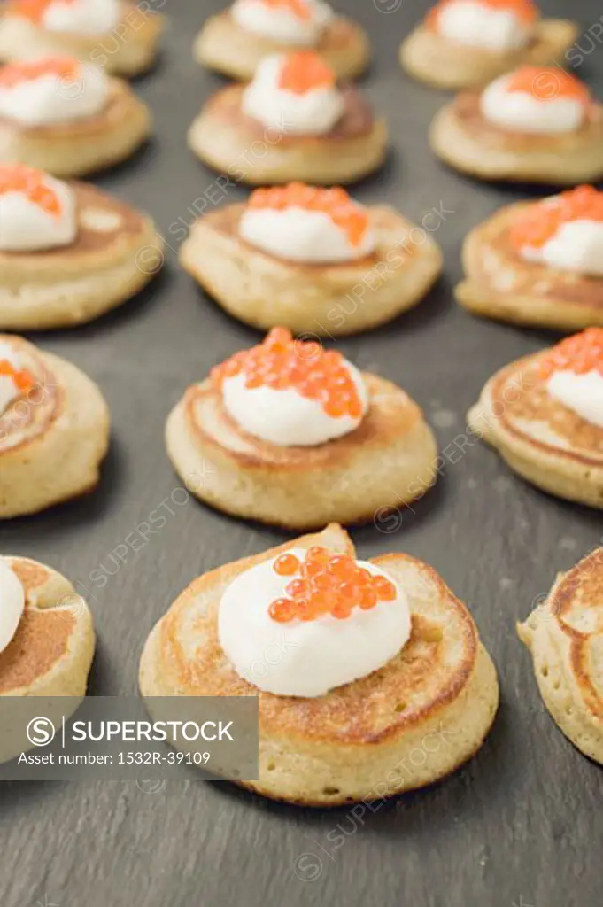 Blinis with sour cream and caviar