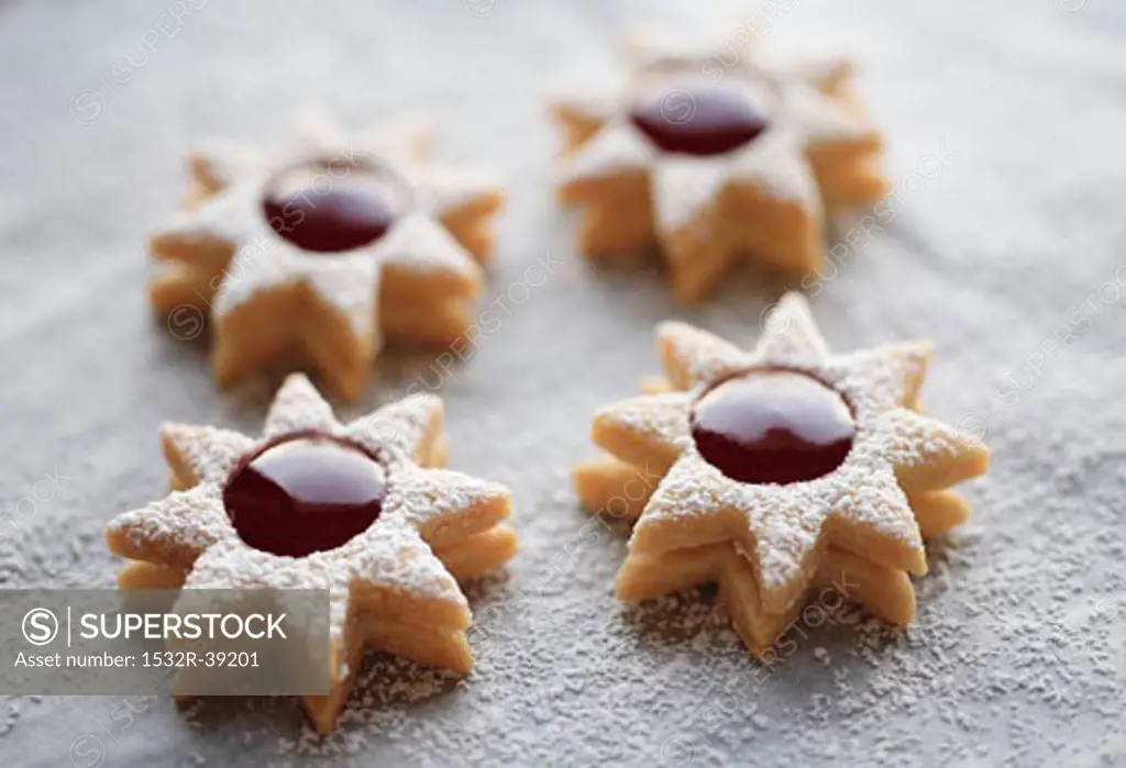 Four jam biscuits with icing sugar