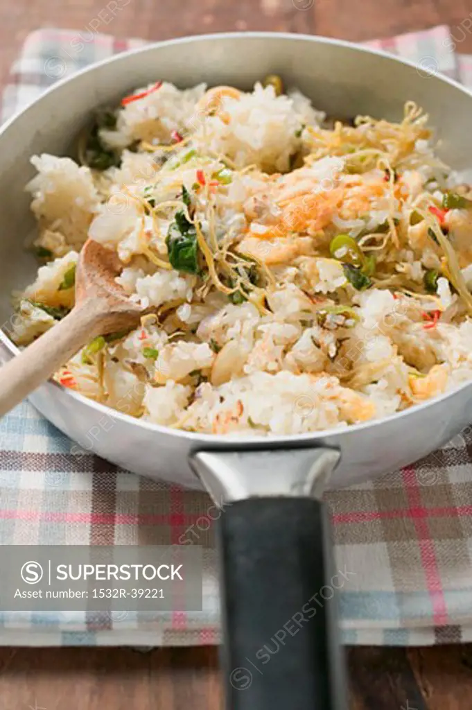 Pan-cooked rice and fish dish with lemon zest (detail)