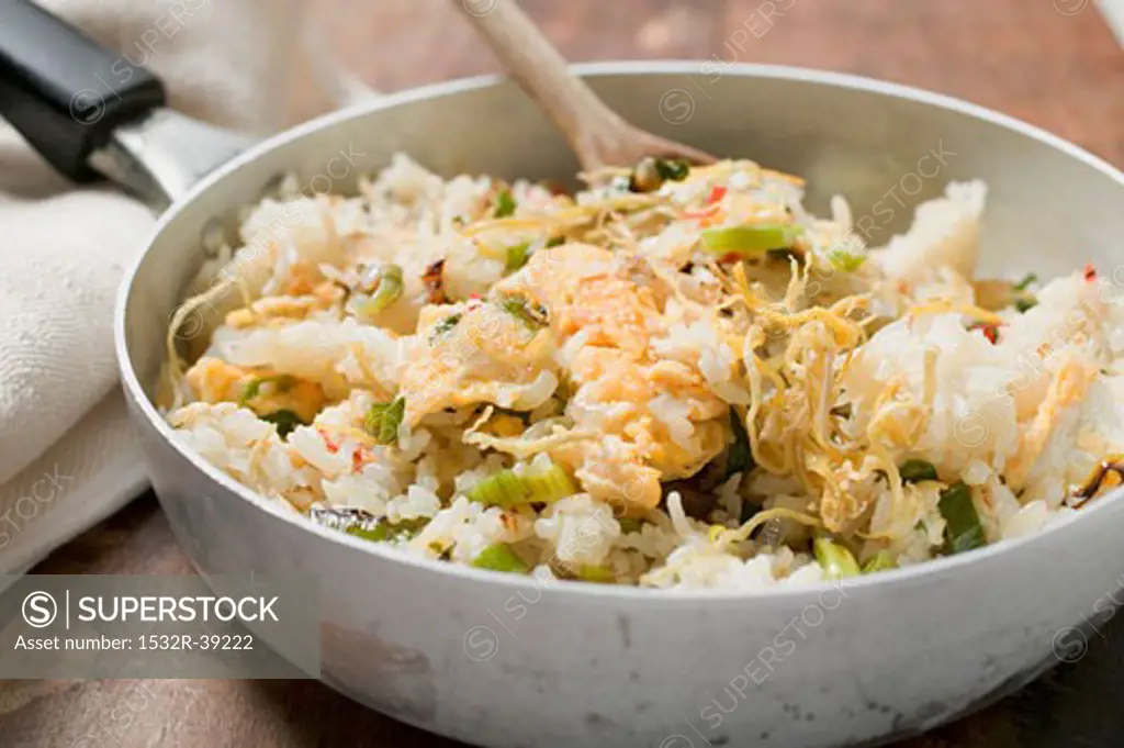 Pan-cooked rice and fish dish with lemon zest