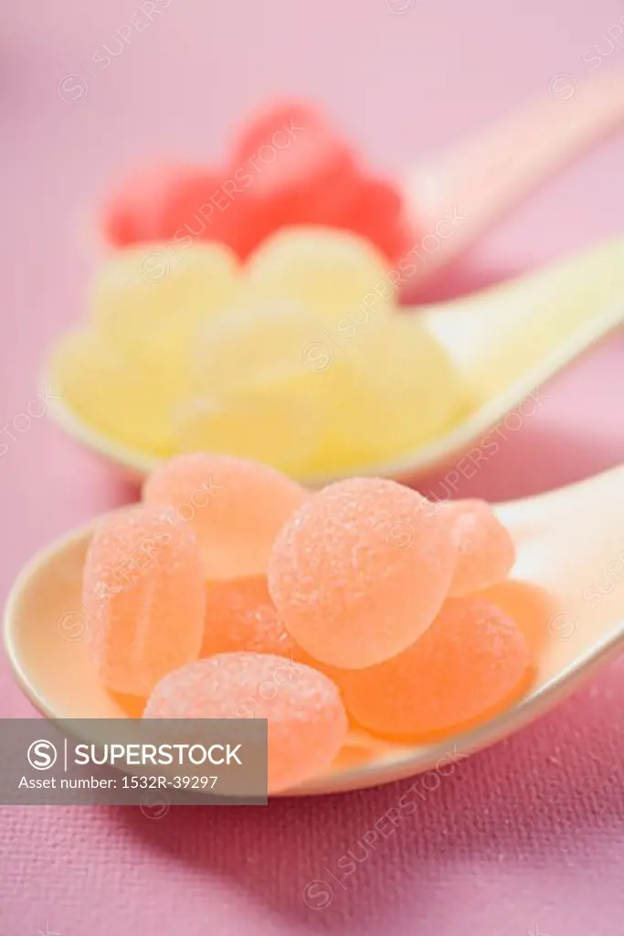Jelly sweets on three spoons