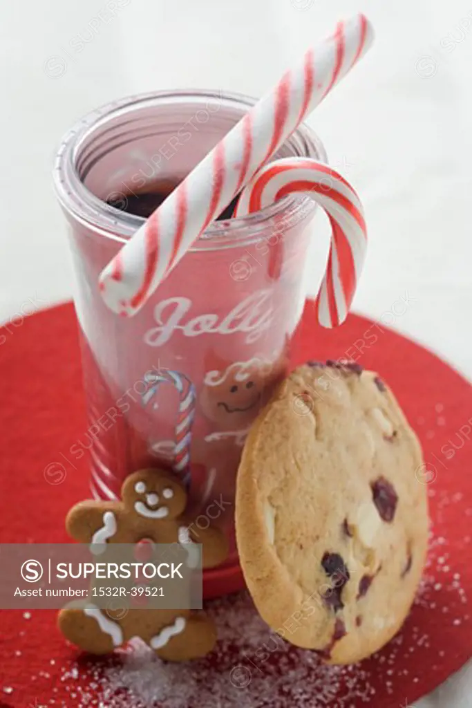 Christmas drink with candy canes and cookies