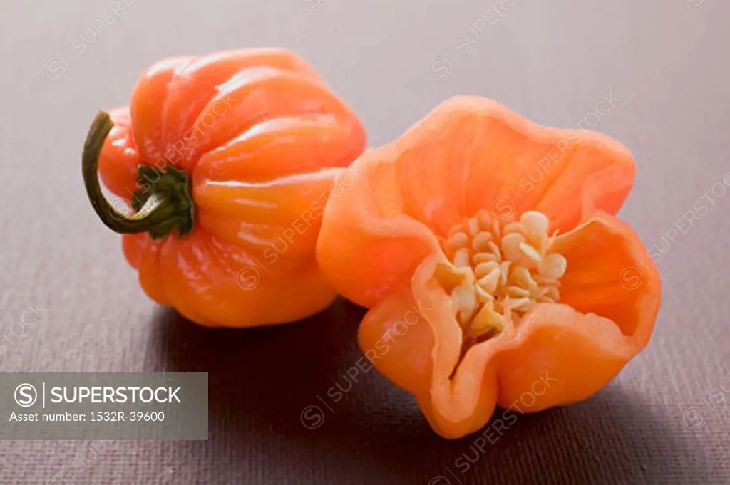 Orange Habanero chillies, whole and a half