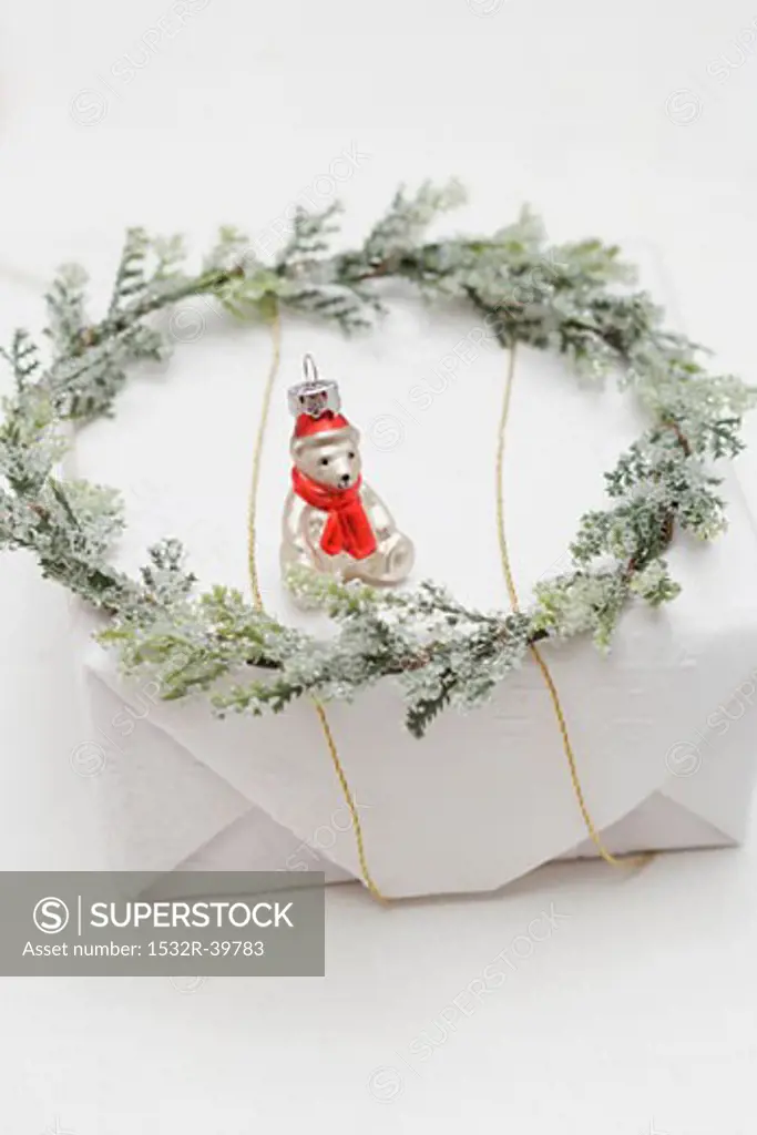 Christmas tree ornament and wreath on Christmas parcel