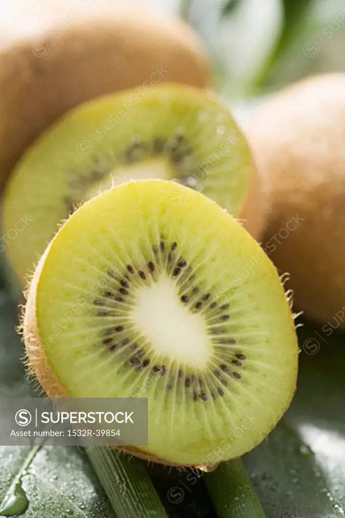 Kiwi fruit, whole and halved