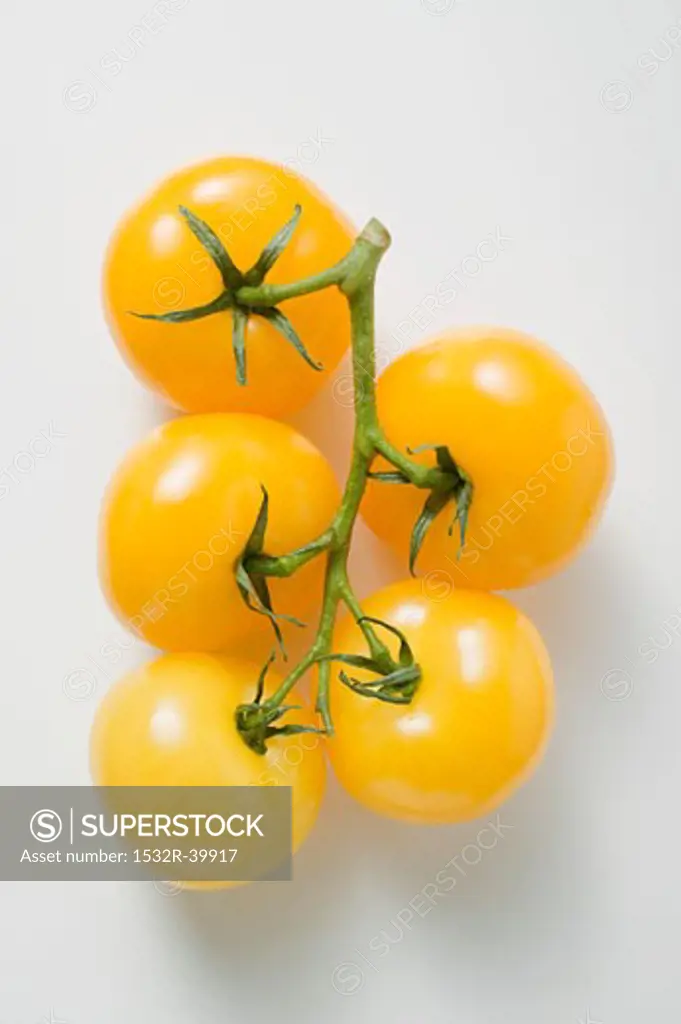 Five yellow cherry tomatoes