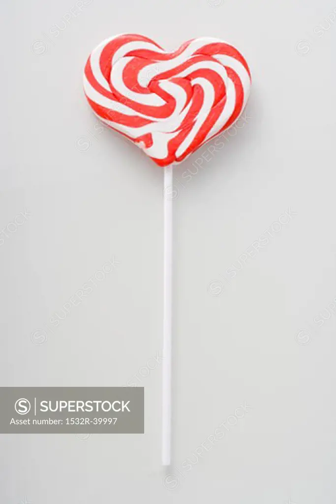 Heart-shaped candy cane lollipop