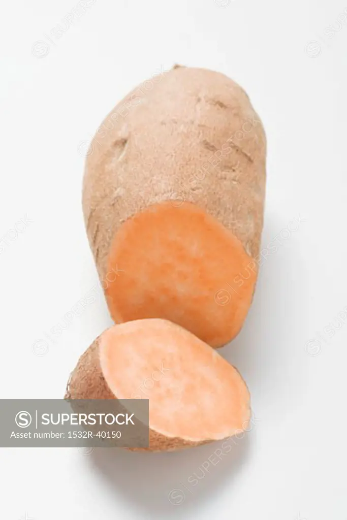 A sweet potato with a piece cut off