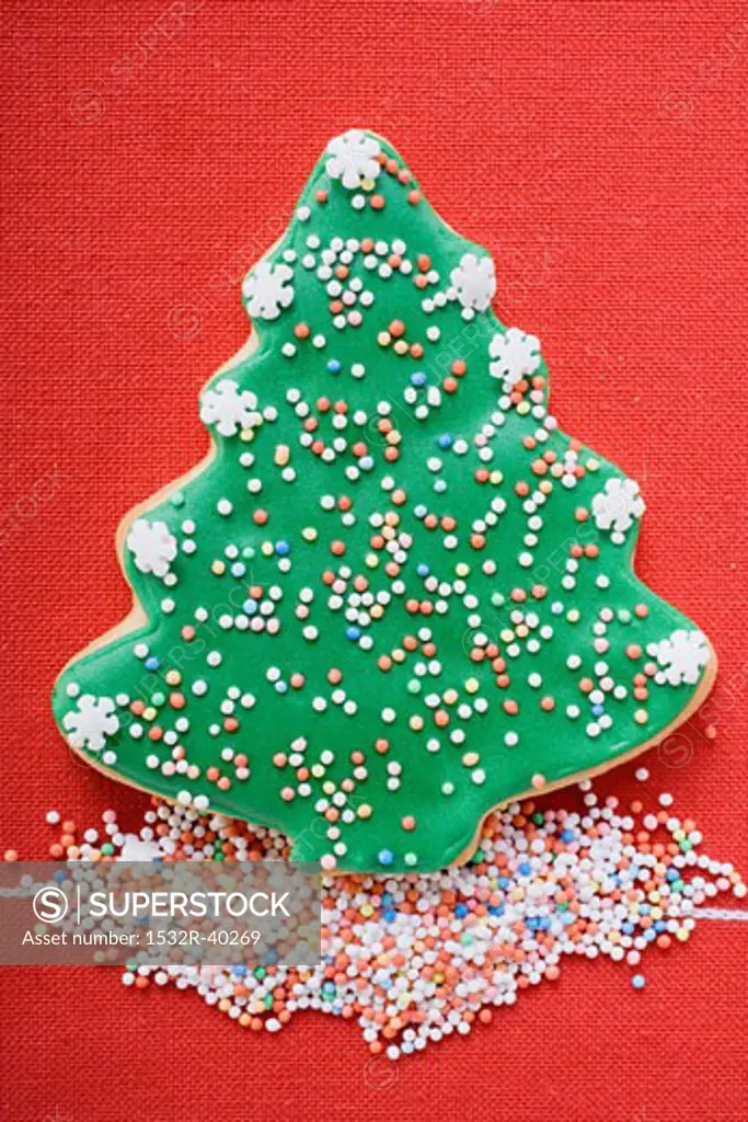 Christmas tree biscuit with coloured sprinkles