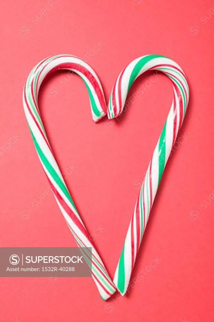 Two candy canes forming a heart