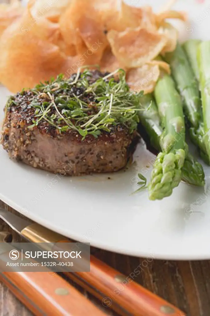 Peppered steak with cress, green asparagus & potato crisps