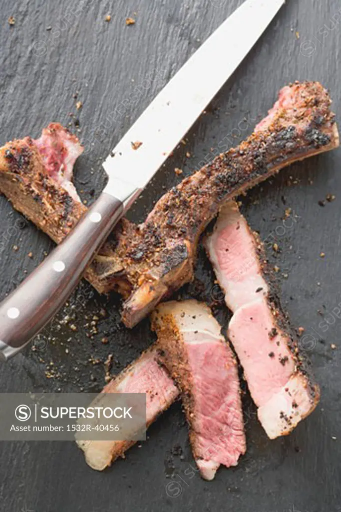 Spicy fried rib eye steak, cut away from the bone