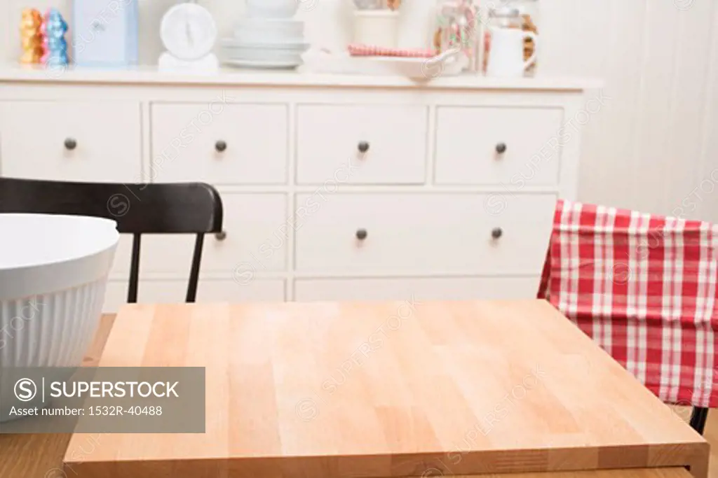 Kitchen scene with large chopping board on table