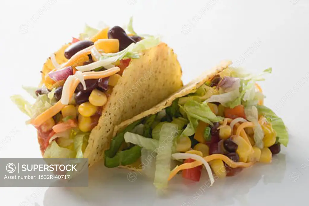 Two tacos filled with sweetcorn and beans