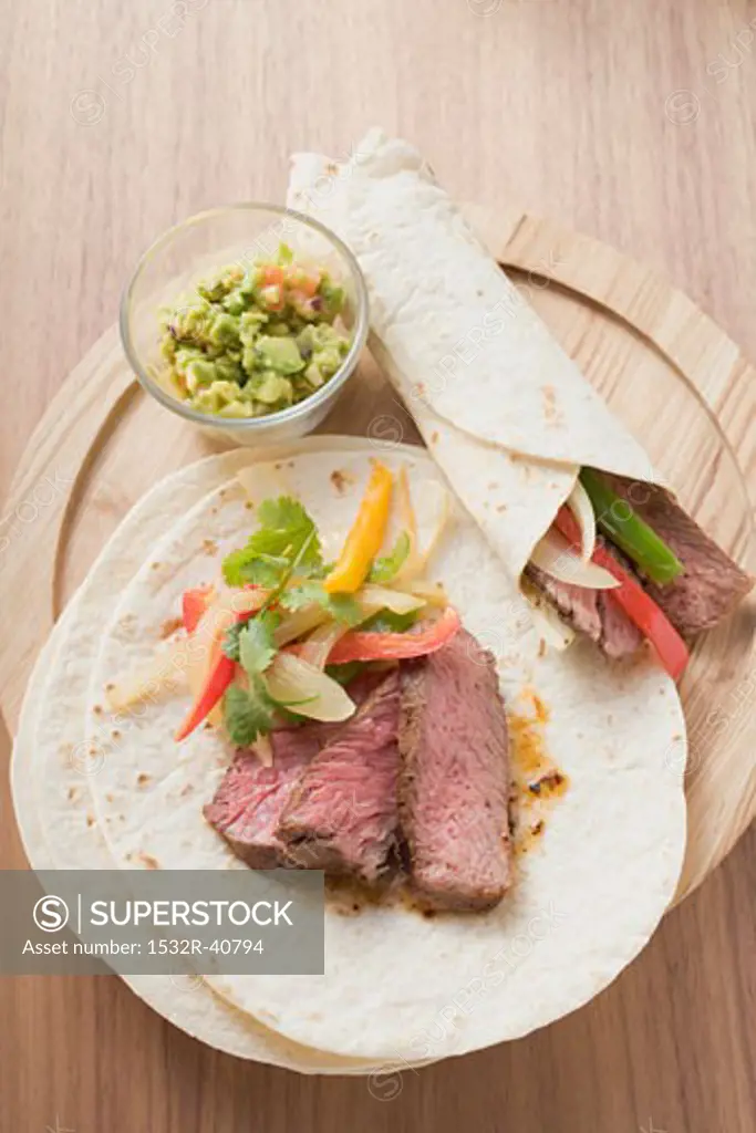 Wraps with beef and pepper filling, guacamole (Mexico)