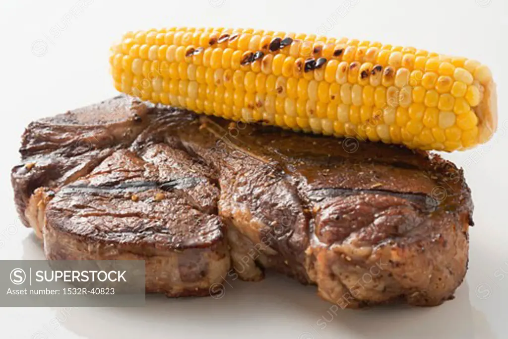 Grilled beef steak with corn on the cob