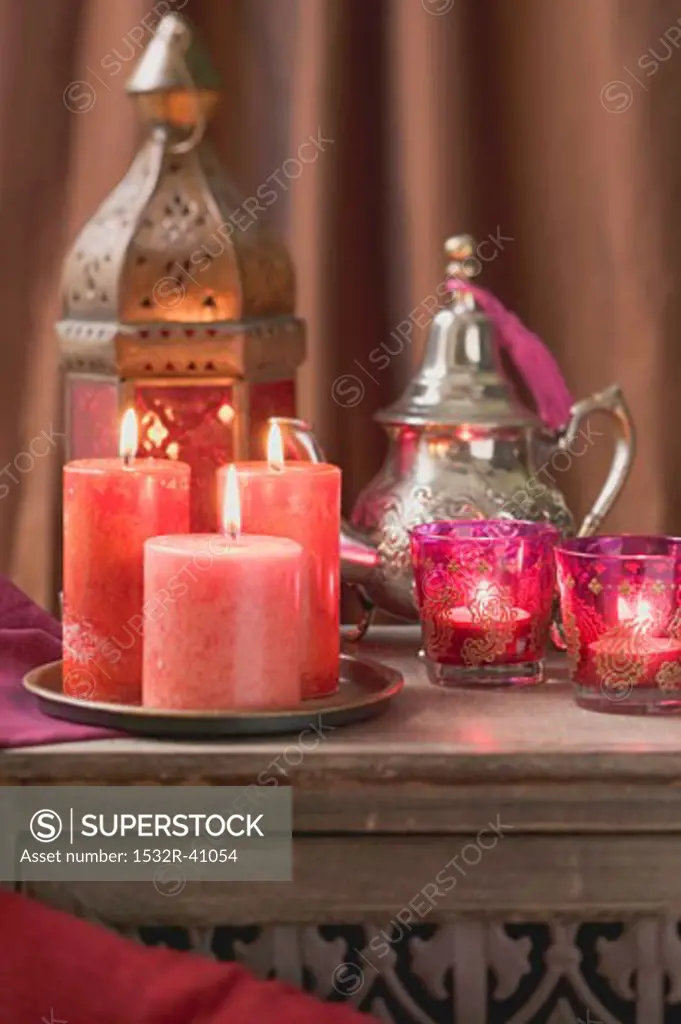 Middle Eastern decoration: candles, windlights, lantern, teapot