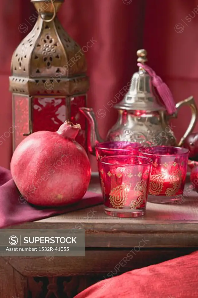 Middle Eastern decorations: pomegranate, windlights, teapot