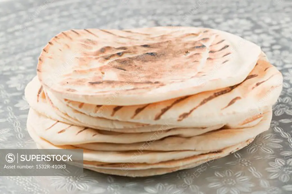 A stack of grilled flatbread