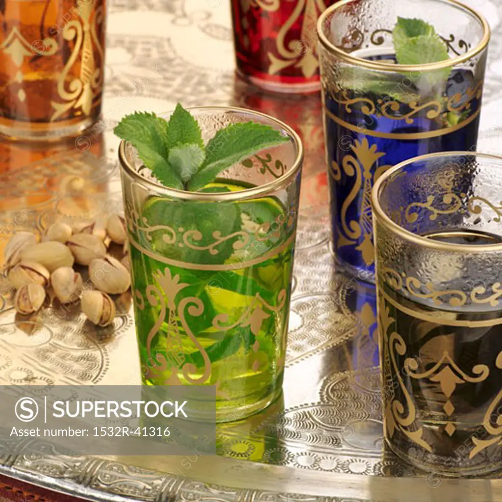 Peppermint tea in Middle Eastern glasses, pistachios