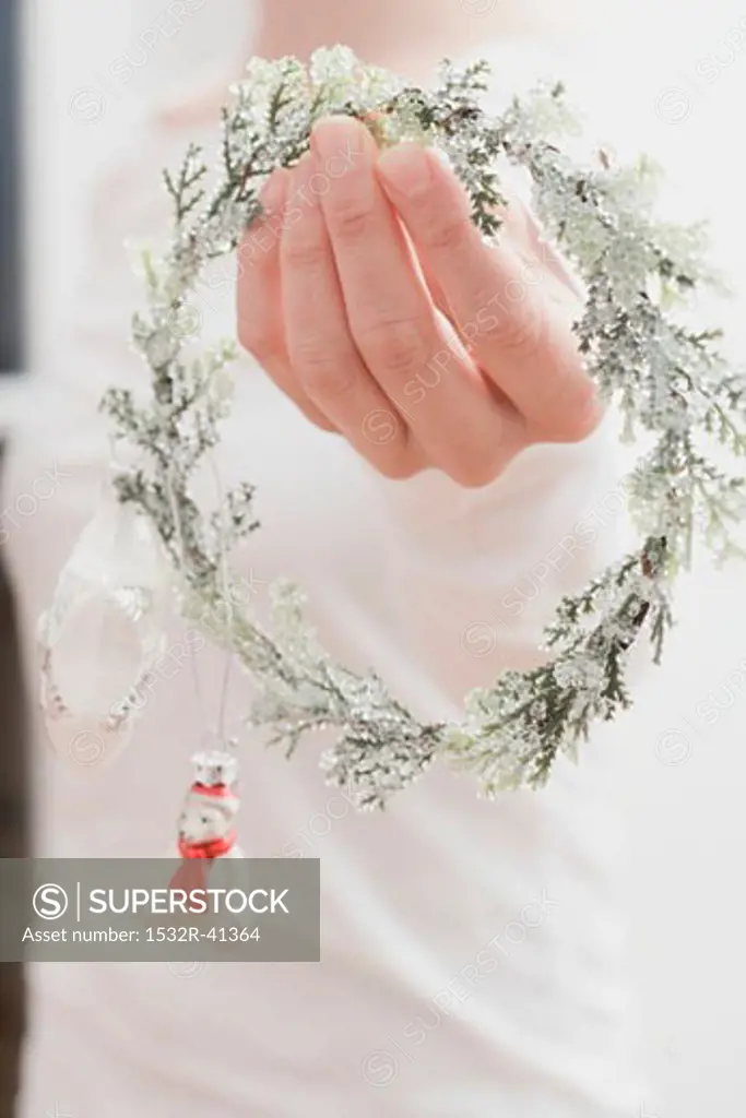 Woman holding Christmas decoration