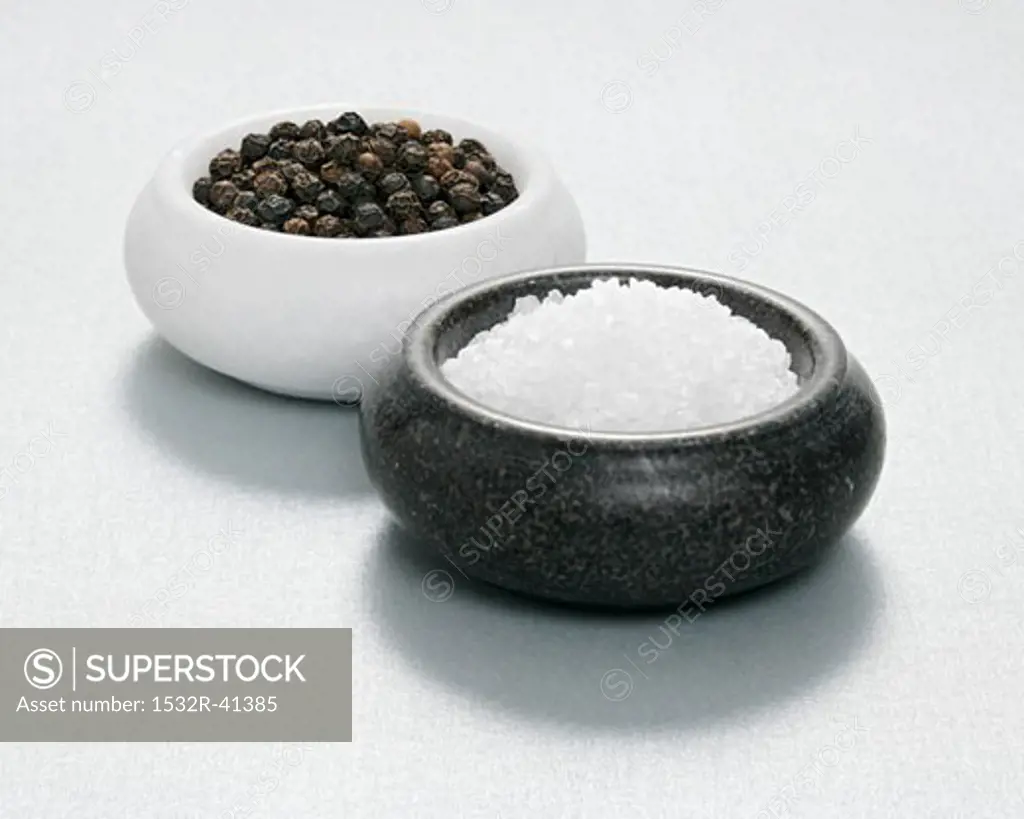 Salt and pepper in dishes