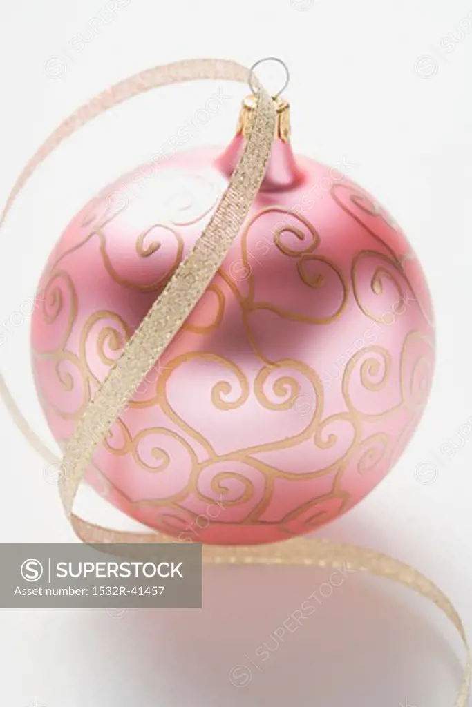 Pink Christmas bauble with gold ribbon