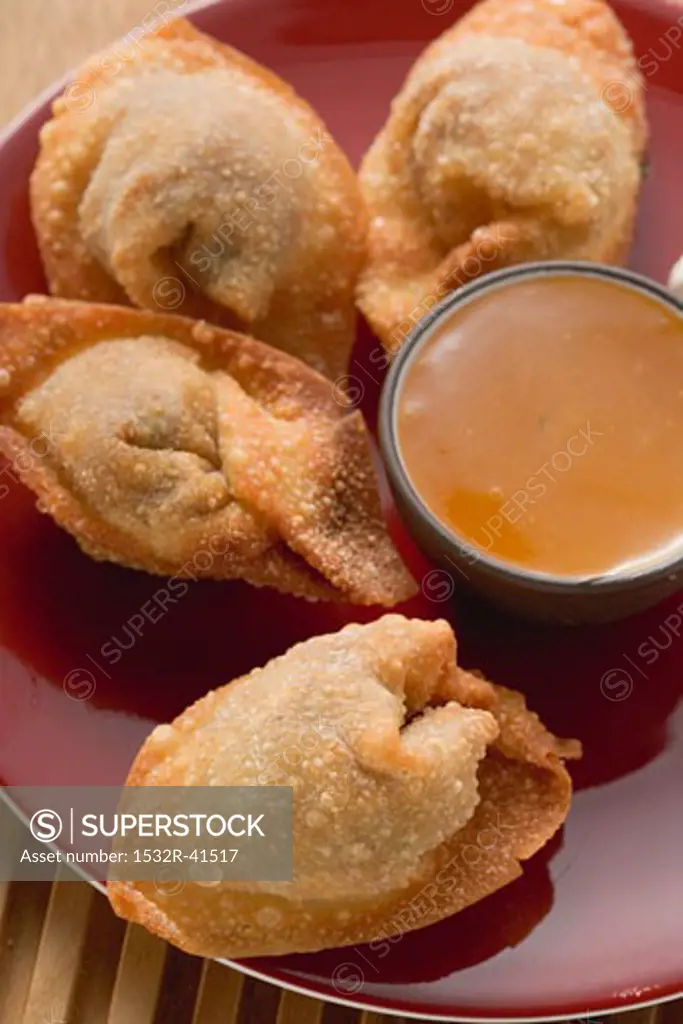 Deep-fried dim sum with sweet & sour sauce (Asia)