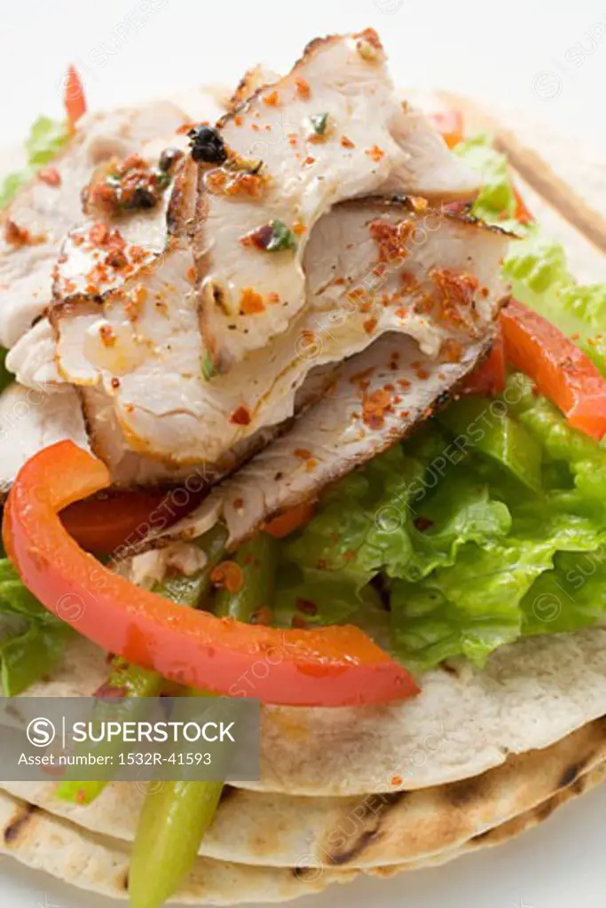 Grilled tortillas with chicken and peppers