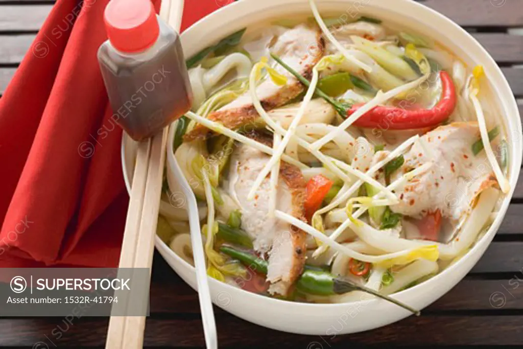Spicy noodle soup with chicken, vegetables & soy sauce (Asia)
