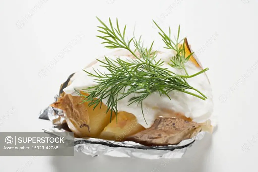 Baked potato with sour cream and dill