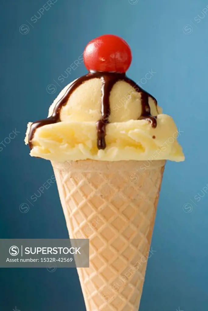 Vanilla ice cream cone with chocolate sauce & cocktail cherry
