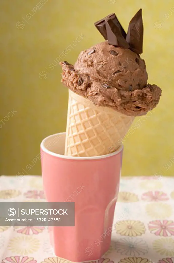 Chocolate ice cream cone in pink beaker