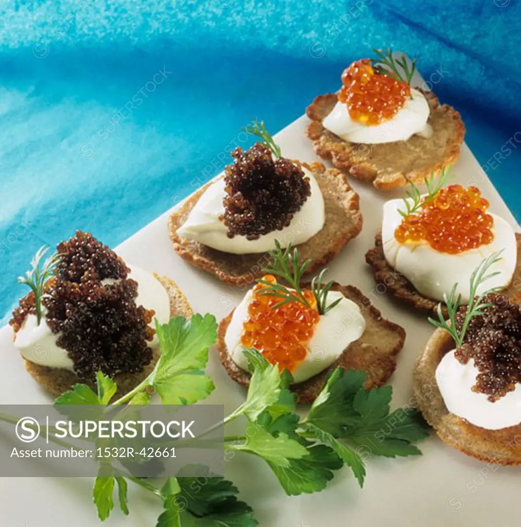 Blinis with sour cream and caviar