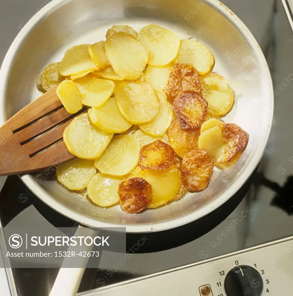 Fried potatoes (Frying potatoes in frying pan)