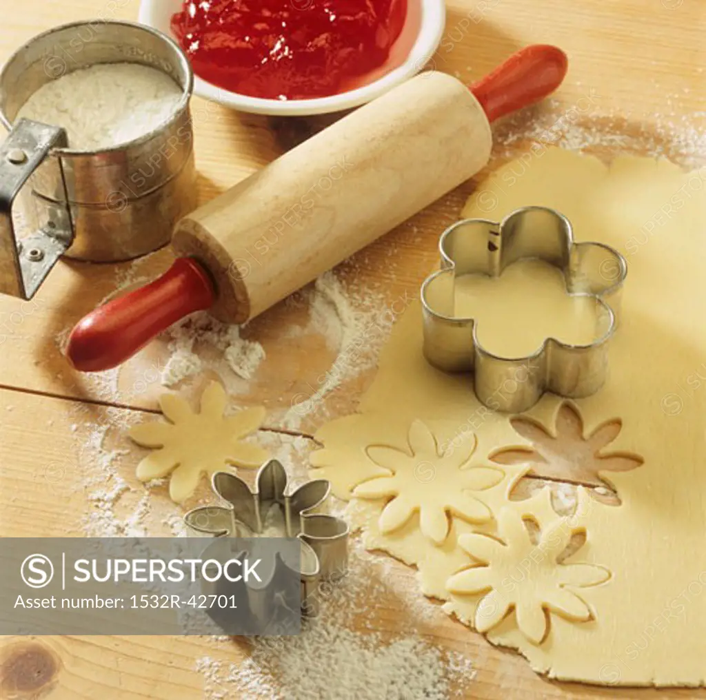 Baking scene with pastry, biscuit cutters, rolling pin