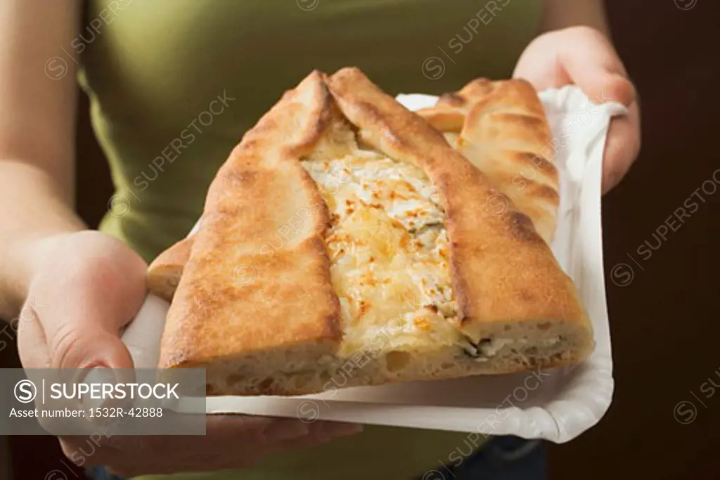 Lahmacun (Turkish pizza) with sheep's cheese filling