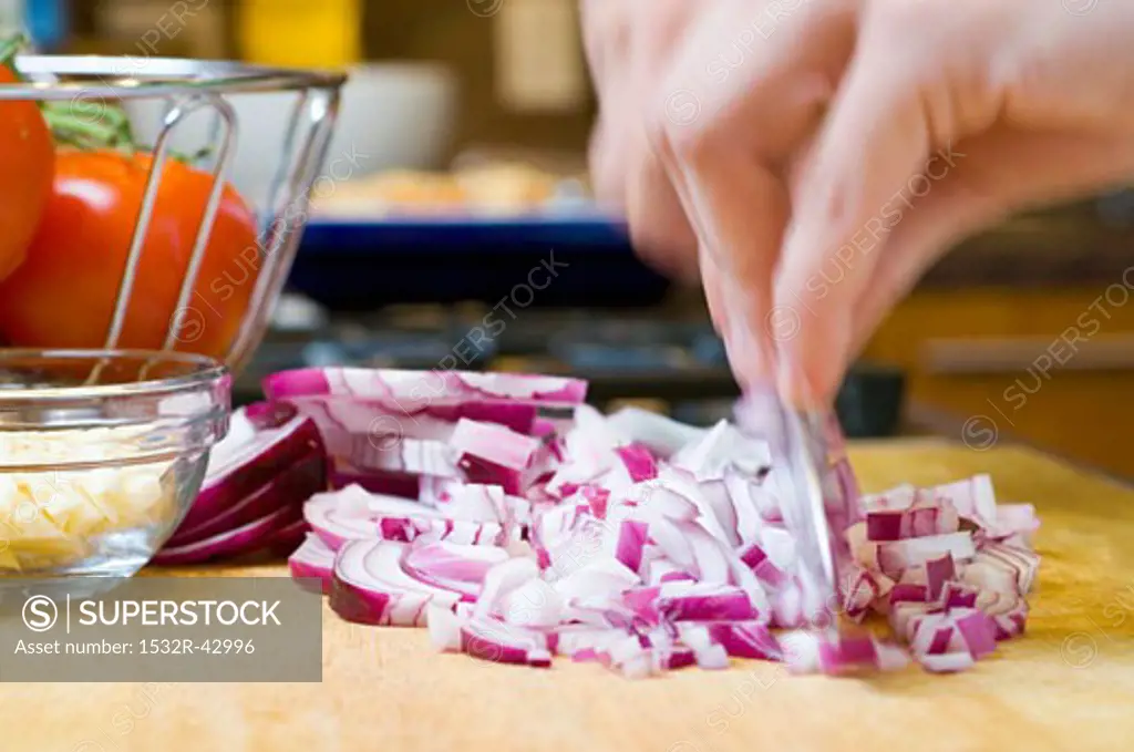 Chopping a red onion