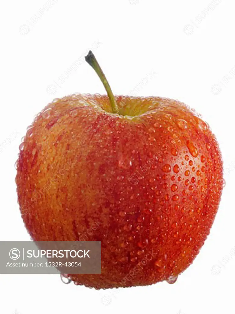 A red apple with drops of water