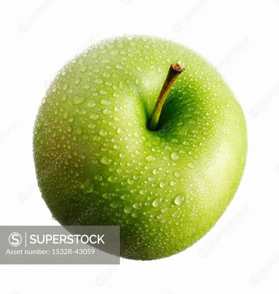 A green apple (Granny Smith) with drops of water